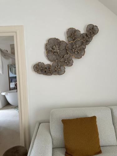 a wall with two heart decorations on a wall at Suite Sami Charming Home in Ostuni