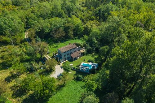 an aerial view of a house in the woods at Villa Mulino Old Mill in Črnica