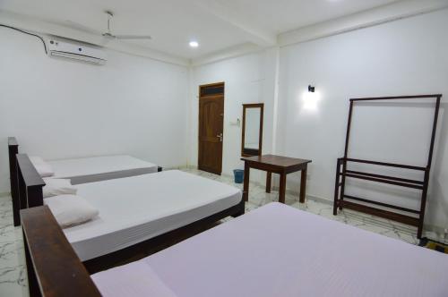 Postel nebo postele na pokoji v ubytování Hotel Sanhida Polonnaruwa