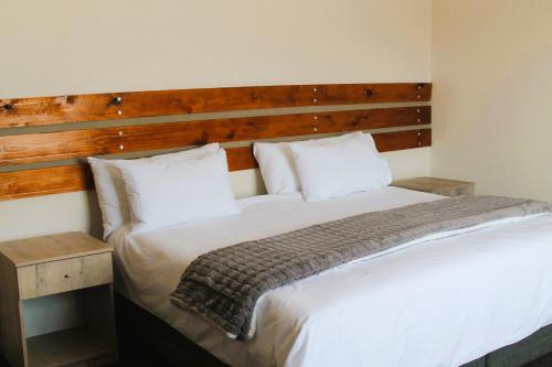 Ένα ή περισσότερα κρεβάτια σε δωμάτιο στο Courtyard Guest House