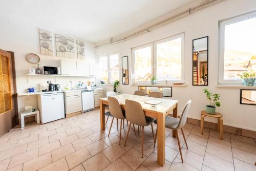 a kitchen and dining room with a table and chairs at Haus Frey in Altaussee
