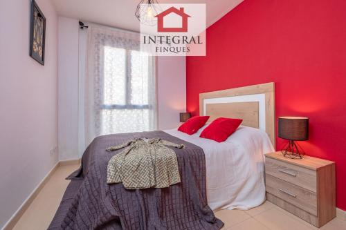 En eller flere senge i et værelse på Sakura Apartment Palamós