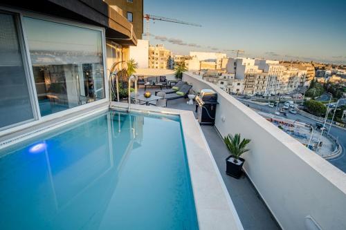 a swimming pool on the roof of a building at D Pool Top in Msida