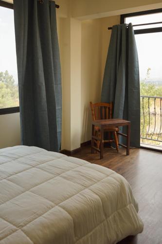 Una cama o camas en una habitación de Arariwa