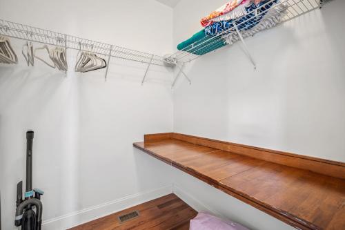 a room with a shelf on the wall at Beach Access - Golf Cart Included - Views of the Marsh and Harbor River - Sleeps 10 in Harbor Island