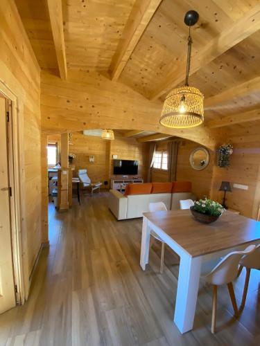 a living room with a table and a couch at Casas Guemon in Zahora
