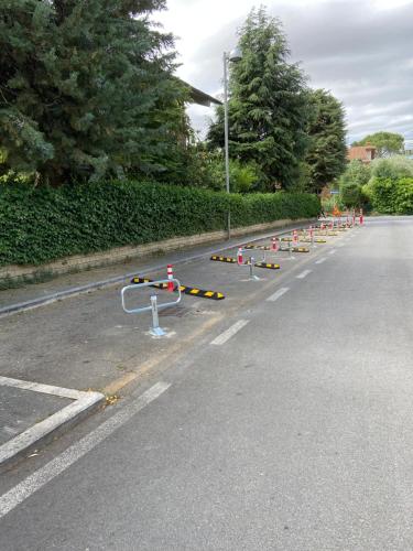 a road with a bunch of orange and white barriers at Agriturismo Il Macchione in Pienza