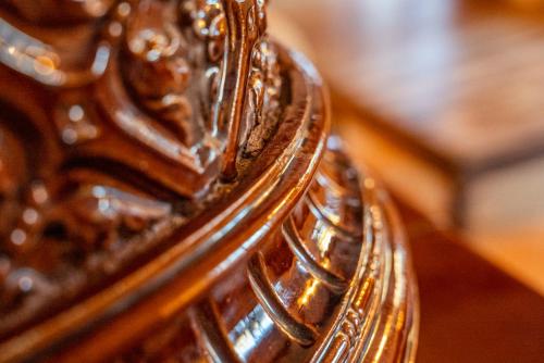 a close up of the reflection of a shiny metal mirror at Haus Frey in Altaussee