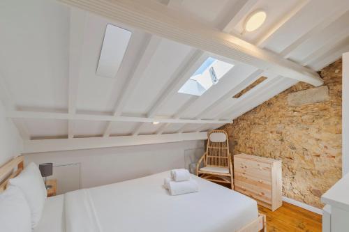 En eller flere senge i et værelse på Casa Bestel Setúbal