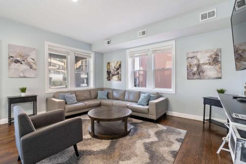 a living room with a couch and a table at Luxe Beach Estate - 4 Bedrooms and 3 Bathrooms in Atlantic City