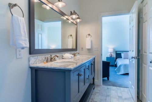 a bathroom with a sink and a mirror at Graceful Oaks in Paso Robles
