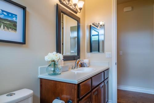 a bathroom with a sink and a mirror at Cloud 9 in Paso Robles