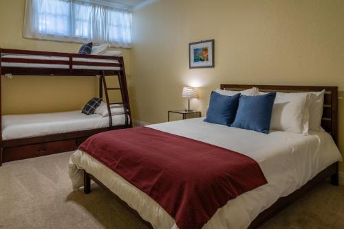 a bedroom with two bunk beds with blue pillows at Union Road Schoolhouse in Paso Robles