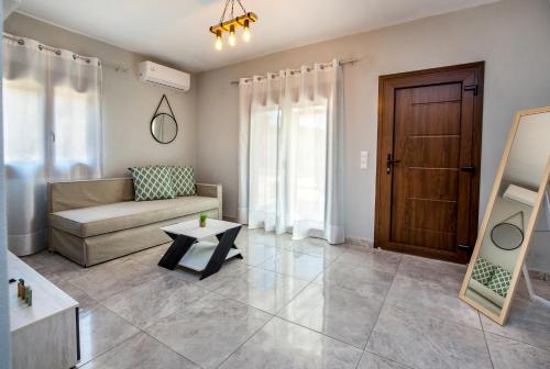 a living room with a couch and a table at Zara Studios in Astris