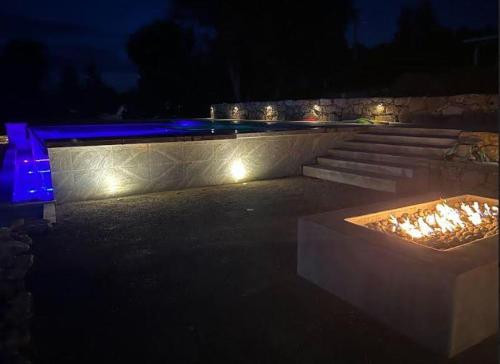 a fire pit with stairs and lights at night at Sunset at Nirvana in San Miguel