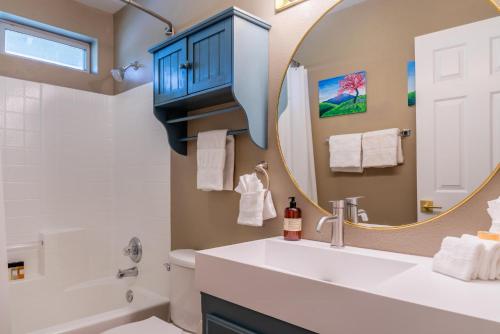 a bathroom with a sink and a mirror at Sunset at Nirvana in San Miguel