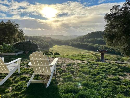 two white chairs sitting on a hill with a view at G2N - G2 North Vineyard in Paso Robles