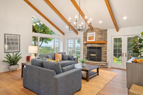 a living room with two couches and a fireplace at G2N - G2 North Vineyard in Paso Robles