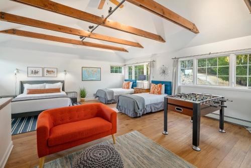 a living room with two beds and a table at G2N - G2 North Vineyard in Paso Robles