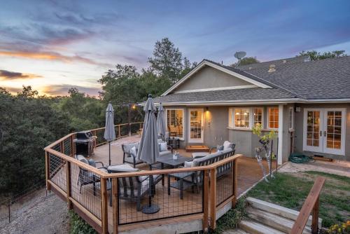 a deck with umbrellas on top of a house at G2N - G2 North Vineyard in Paso Robles