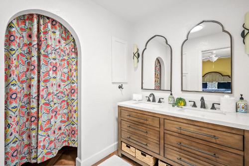 a bathroom with a sink and a shower curtain at Hacienda Buena Vida in Templeton
