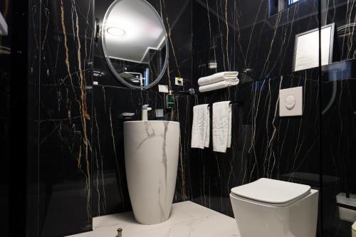 Koupelna v ubytování Le Blanc Cotroceni Hotel