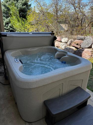 a large hot tub sitting on a patio at Alpine Base Camp Hot Tub 1Gbps pool table foosball in Cottonwood Heights