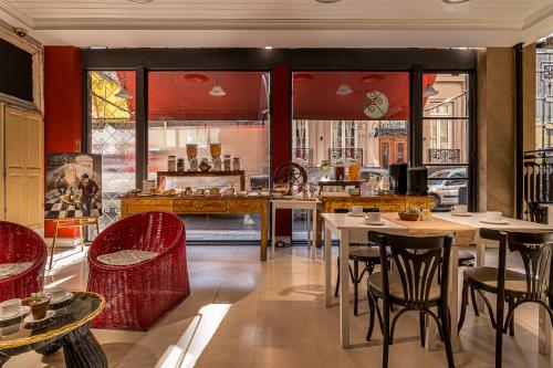 a restaurant with tables and chairs in a room at Patios de San Telmo in Buenos Aires