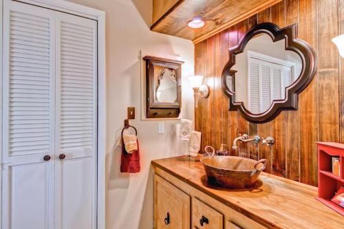 a bathroom with a sink and a mirror at Las Palmas in Templeton