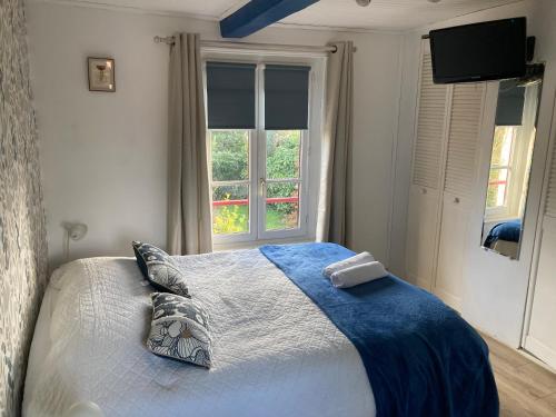 Postel nebo postele na pokoji v ubytování Les chambres d'hôtes Le Val d'Honfleur