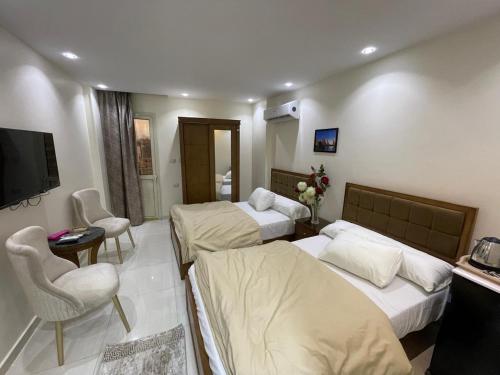 Postel nebo postele na pokoji v ubytování Families Inn