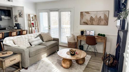 a living room with a couch and a table at Villa Signor in Norwich