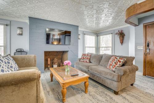 a living room with a couch and a coffee table at 4 Mi to Dtwn Kalamazoo Central Apt in Kalamazoo