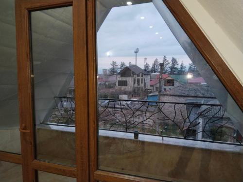 a window with a view of a city at Villa Vanila in Kutaisi