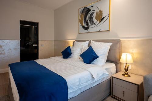 Postel nebo postele na pokoji v ubytování Le Blanc Cotroceni Hotel