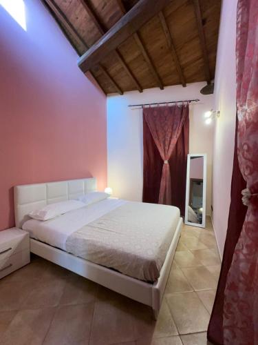 Ένα ή περισσότερα κρεβάτια σε δωμάτιο στο La Casa di Nonna Bice