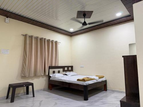a bedroom with a bed and a ceiling at Fortune Farms - Scenic resort with Raindance,Gazebo,Pool&Hill Views in Chinchavli