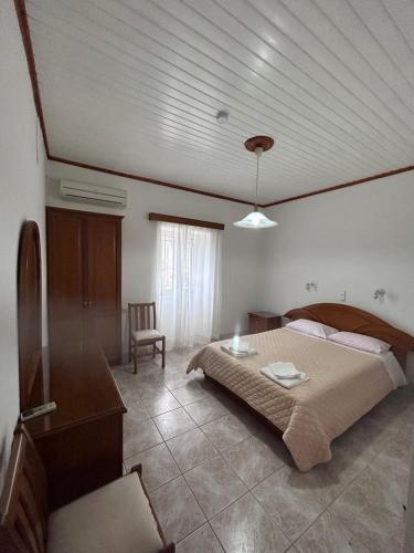 Ένα ή περισσότερα κρεβάτια σε δωμάτιο στο Villa Delphini
