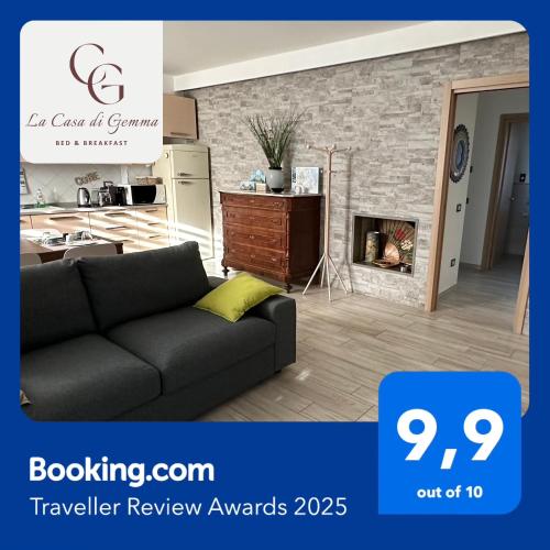 a living room with a couch and a fireplace at La Casa di Gemma B&B in Villa Vomano