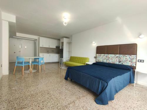 A bed or beds in a room at Apartamentos Bello Lanzarote