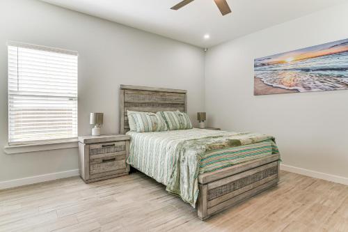 a bedroom with a bed and a ceiling fan at Modern Port Isabel Home Coastal Family Home! in Port Isabel