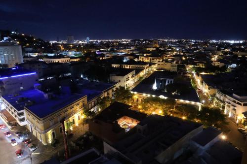 an aerial view of a city at night at Departamentos en Sunset View frente al malecón de Mazatlán in Mazatlán