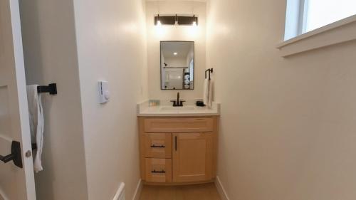 a bathroom with a sink and a mirror at Renovated Studio 5 Min from Scenic Lake CDA - Pet Friendly in Coeur d'Alene
