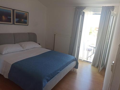 Postel nebo postele na pokoji v ubytování Apartment Ema