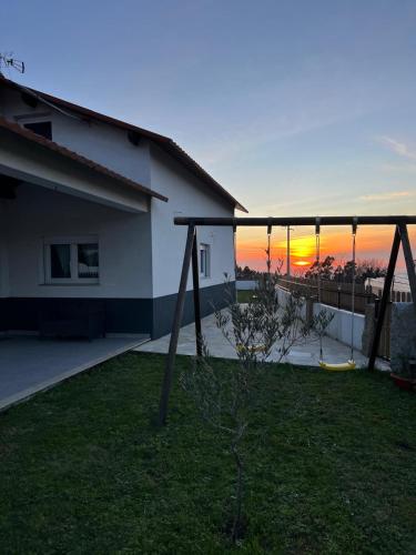a view of the sunset from the backyard of a house at Casa Na Serra - Alagoa Blue in Oliveira de Frades