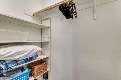 a walk in closet with white walls and shelves at 7 Mi to Folsom Lake Sacramento Area Apartment in Folsom