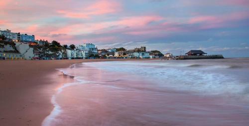 a view of a beach with buildings in the background at 8 Ashton Villa in Broadstairs