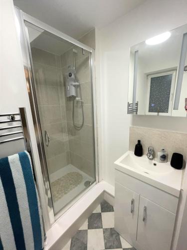 a bathroom with a shower and a sink at 8 Ashton Villa in Broadstairs