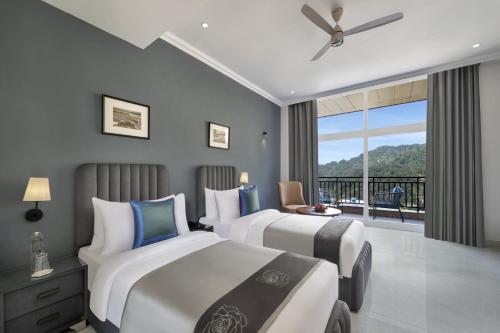 Ein Bett oder Betten in einem Zimmer der Unterkunft juSTa Rasa Retreat & Spa Rishikesh