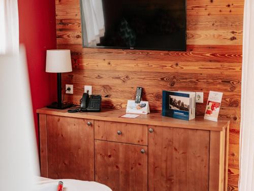 a wooden cabinet with a phone on top of it at Ferienhaus in Schierke for 6 Personen in Schierke